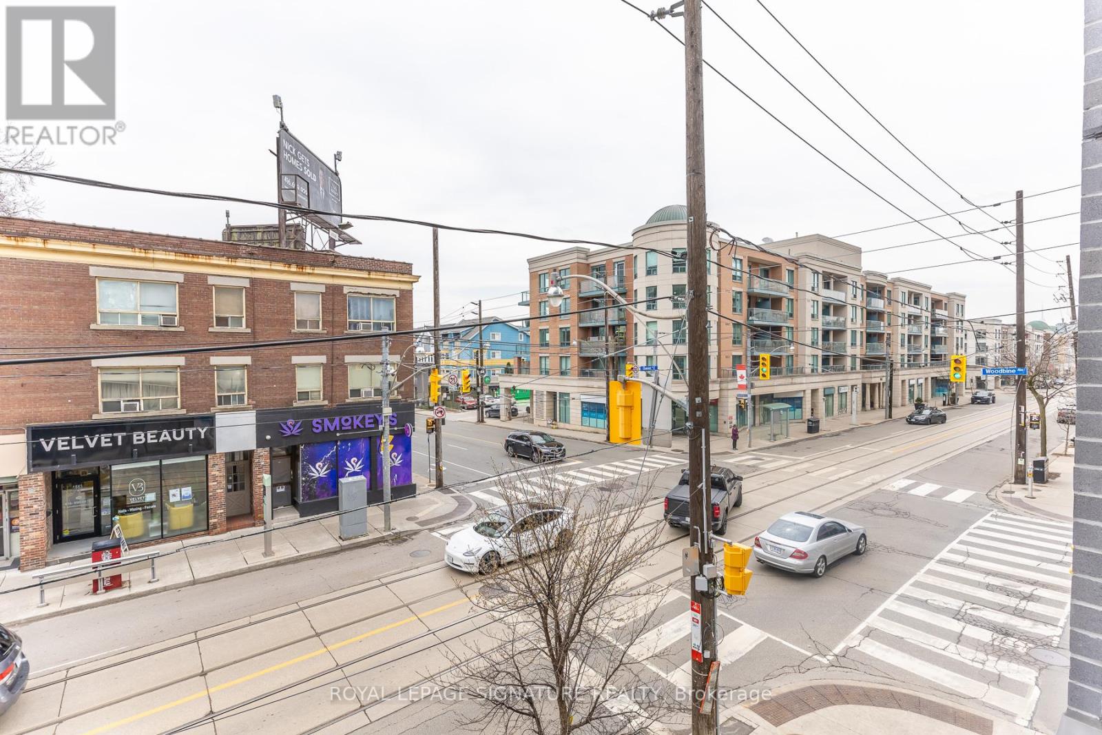 A street view with a building that has a sign that says Velvet Beauty.