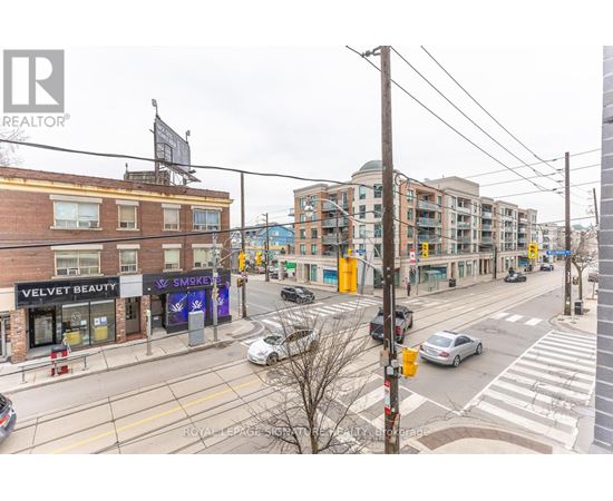 A street view with a building that has a sign that says Velvet Beauty.