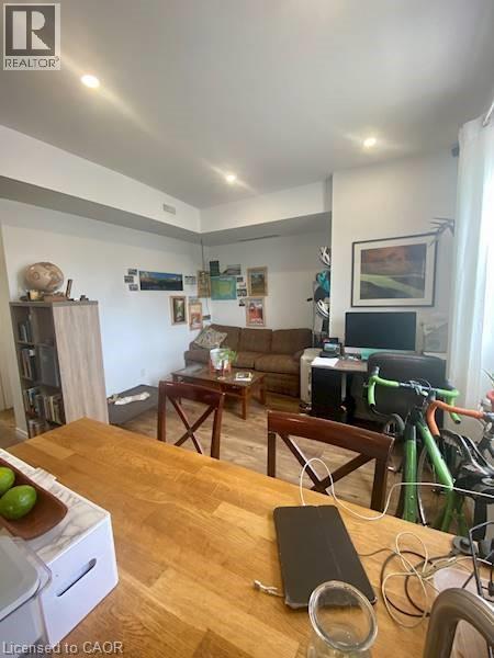 A living room with a couch, a coffee table, and a bicycle.