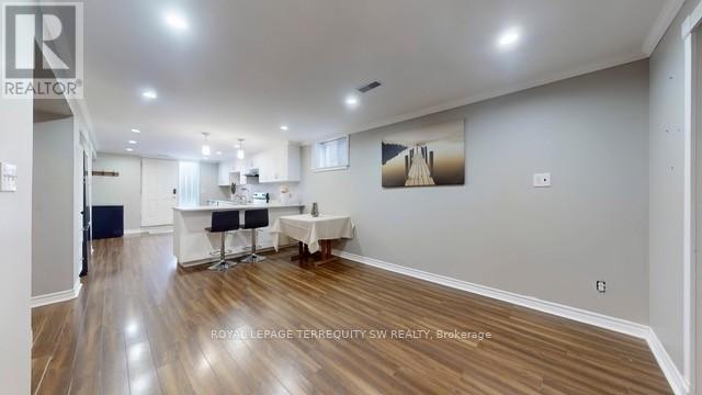 A realtor's office with a desk and chairs.