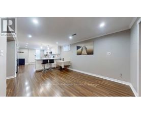 A realtor's office with a desk and chairs.