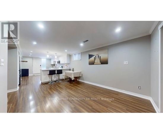 A realtor's office with a desk and chairs.