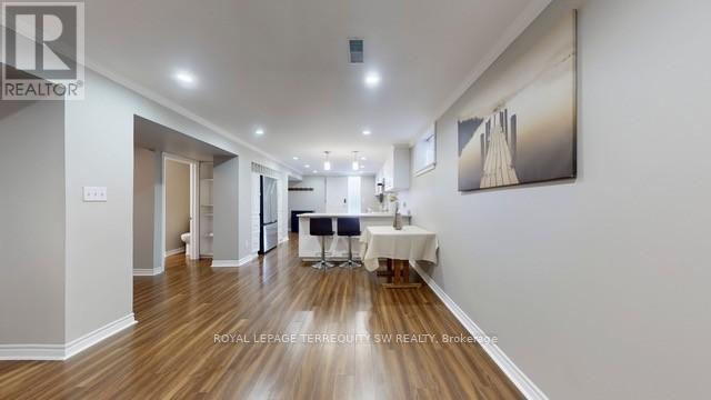 A spacious room with a dining table set up in the middle.