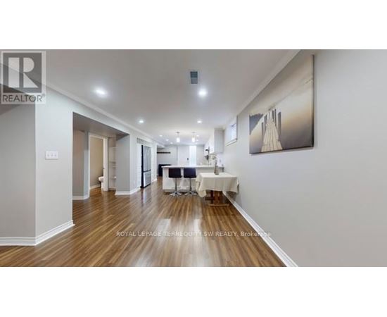A spacious room with a dining table set up in the middle.