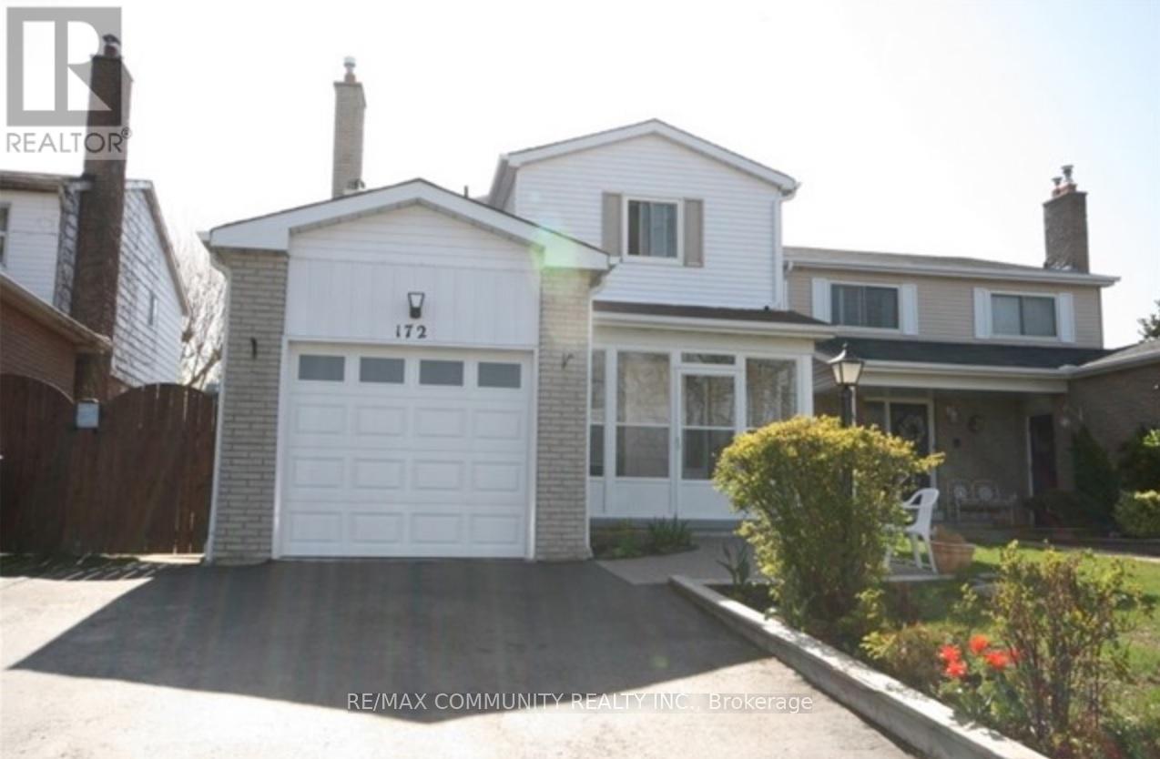 A white house with a garage door numbered 172 is for sale.