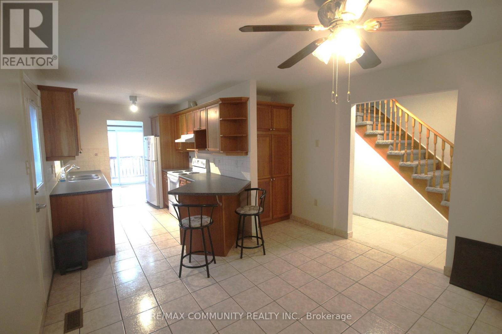 A kitchen with a dining table and chairs is shown in the image.
