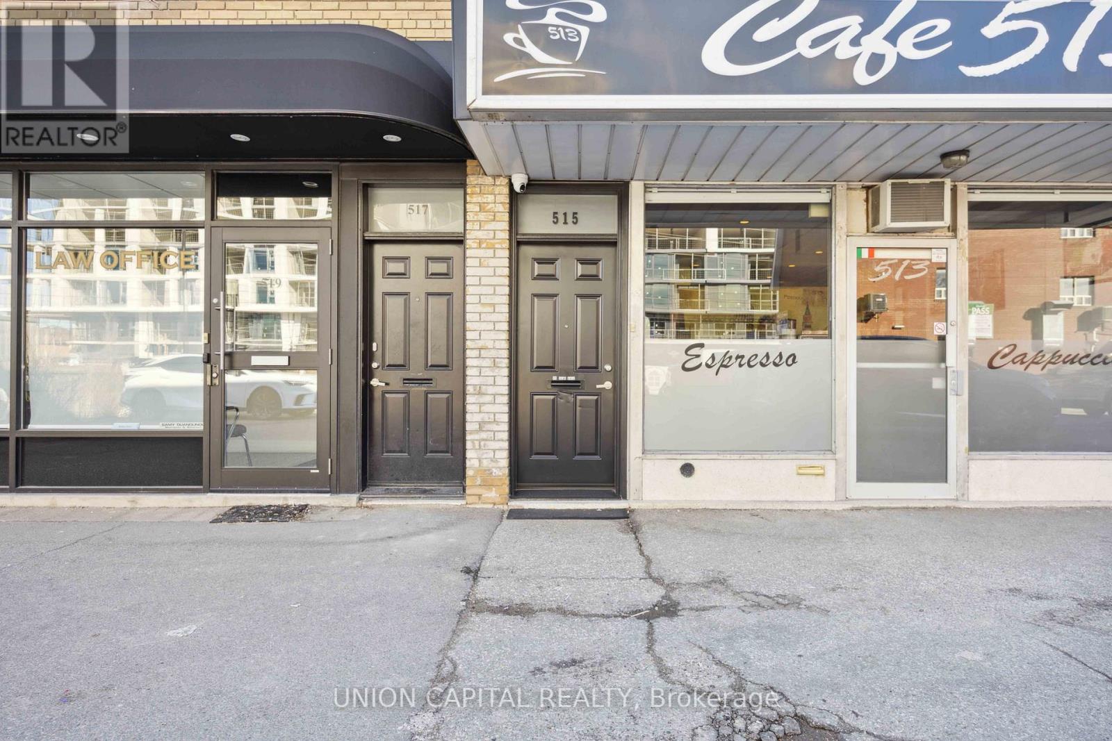 A building with a cafe on the ground floor and a law office on the upper floor.