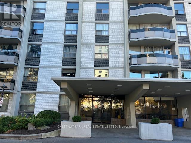 A large building with a sign that says Chestnut Park Real Estate Limited Brokerage.
