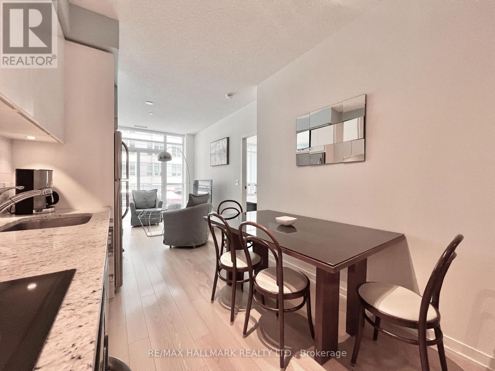 A dining area with a table and chairs is shown in the image.