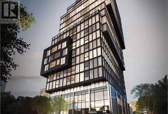 A modern building with a glass facade is depicted in the image.