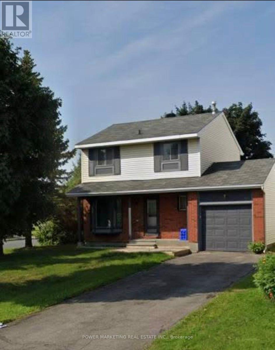 A house with a grey roof and a brick chimney is for sale.