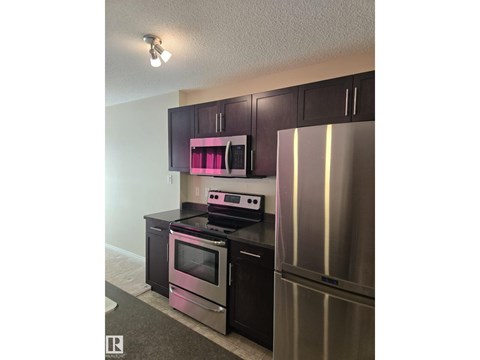 A kitchen with a stove and oven.