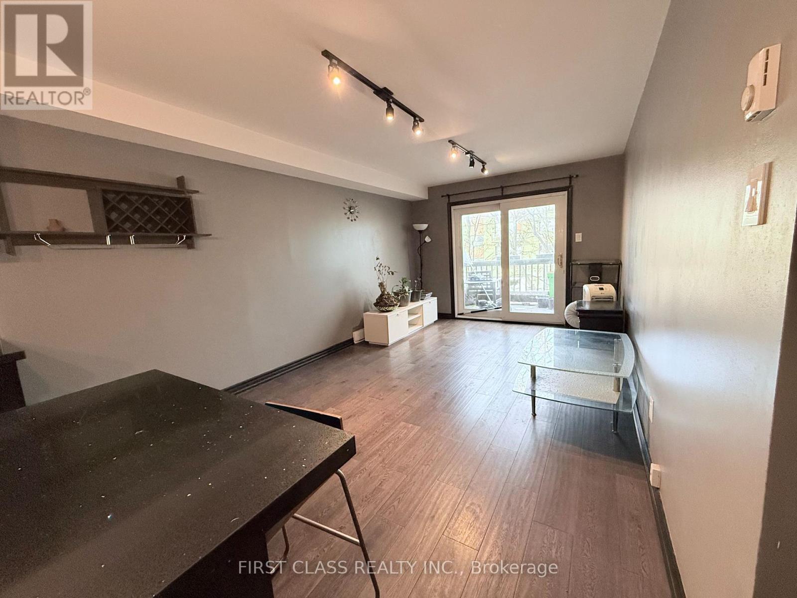 A room with a table and chairs in it.