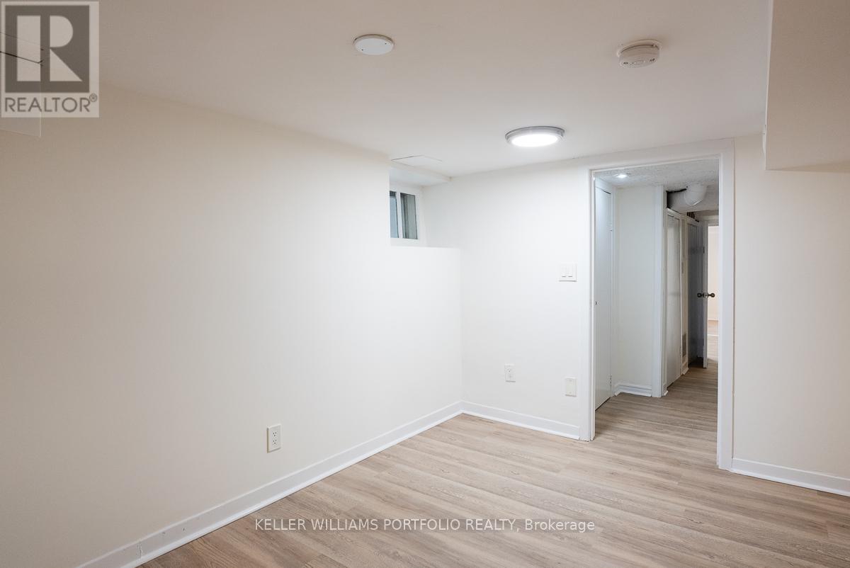 A room with a doorway leading to another room.