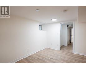 A room with a doorway leading to another room.