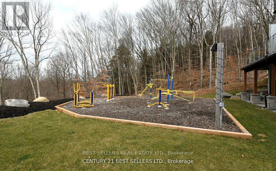 A playground with a slide and swings in a backyard.