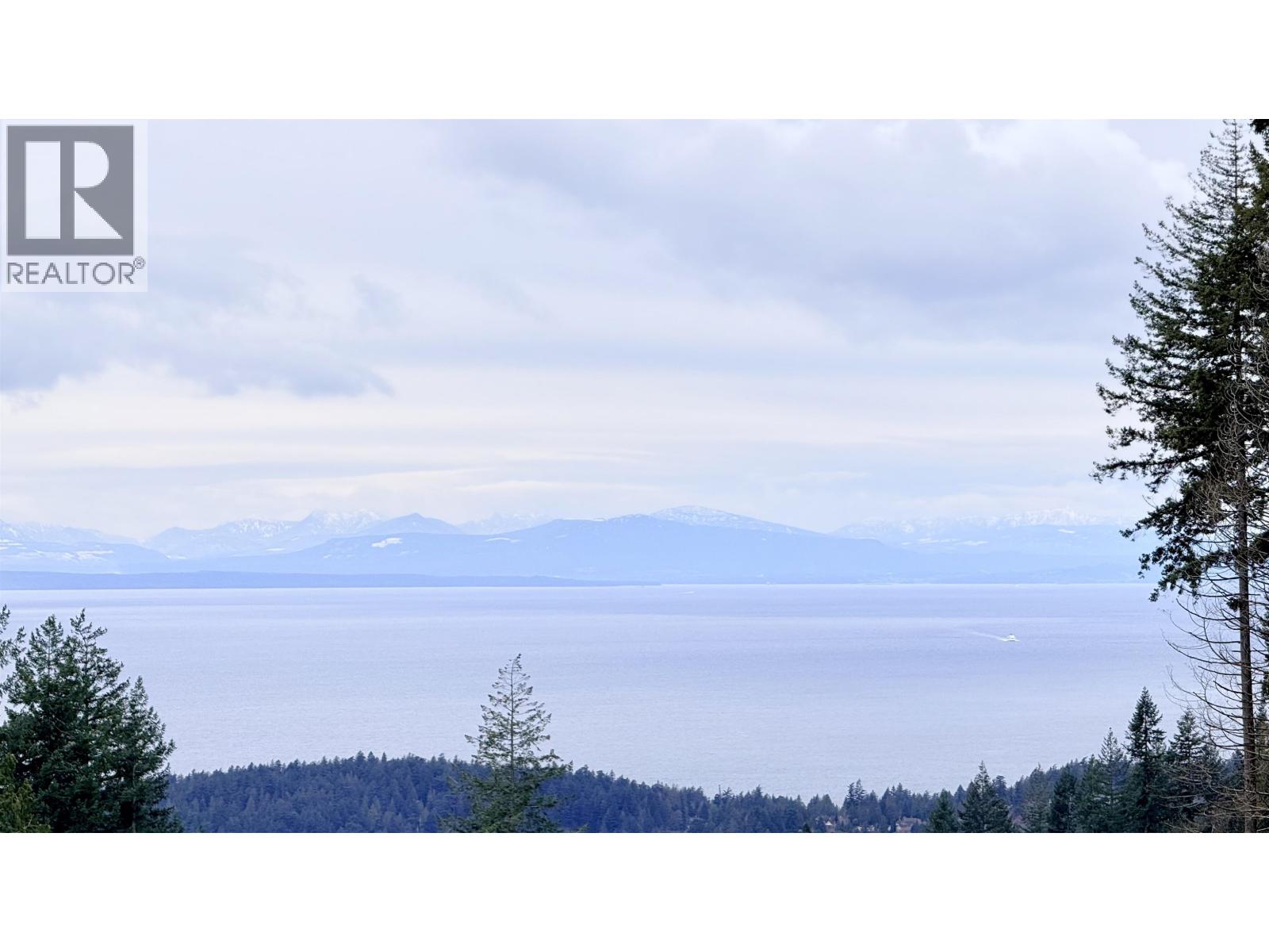 A realtor logo is in the upper left corner of a landscape image.