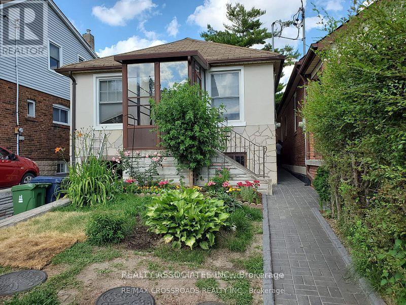 A house with a garden in front of it.