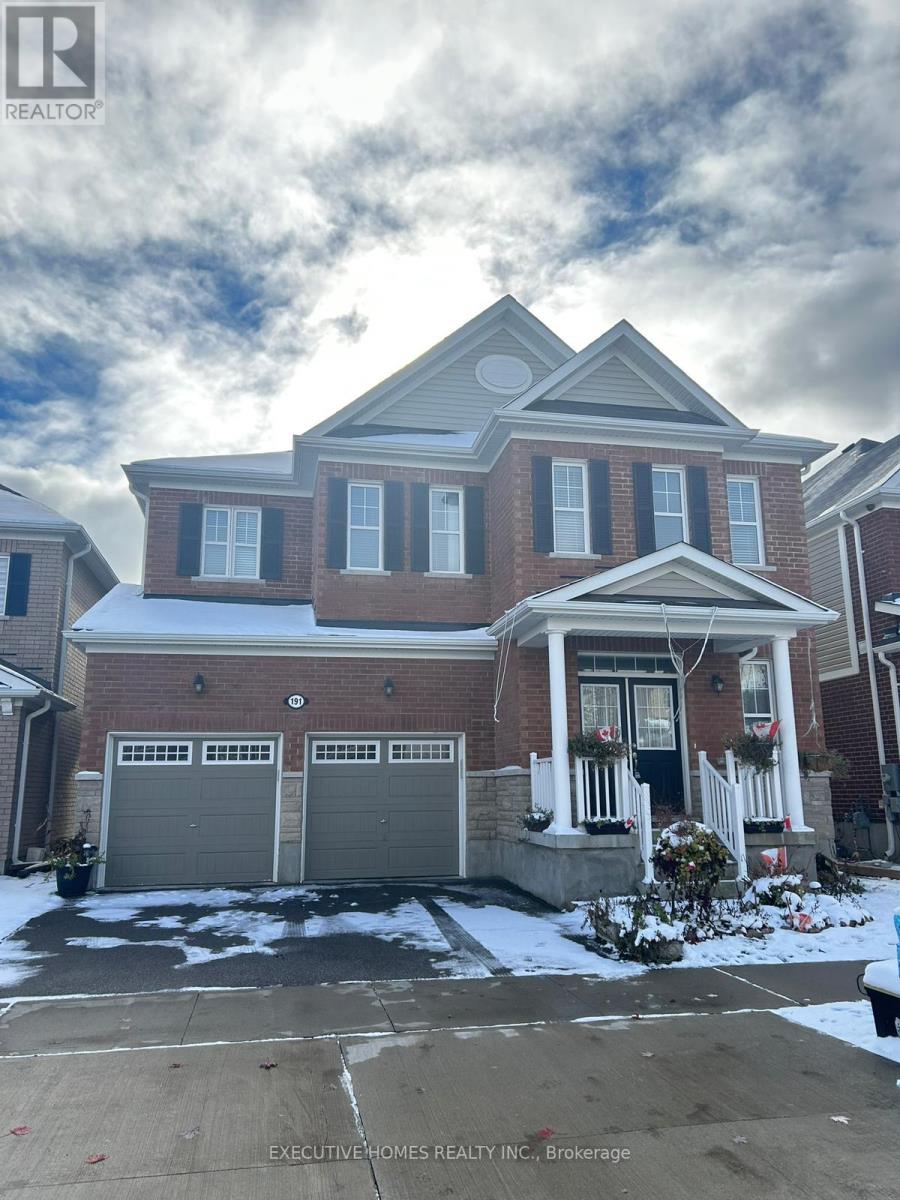 A house with a snowy front yard is for sale.