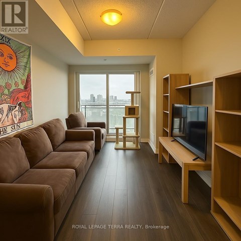 A living room with a brown couch and a television.