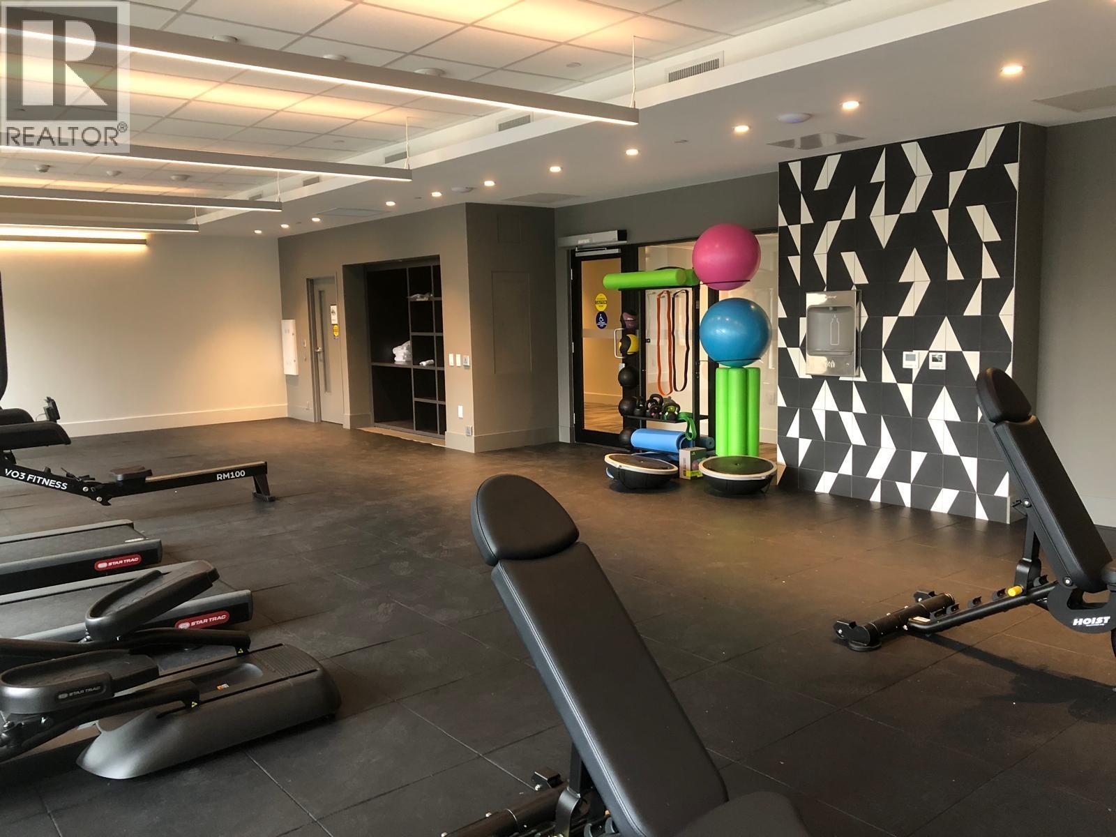 A gym with treadmills and exercise equipment.