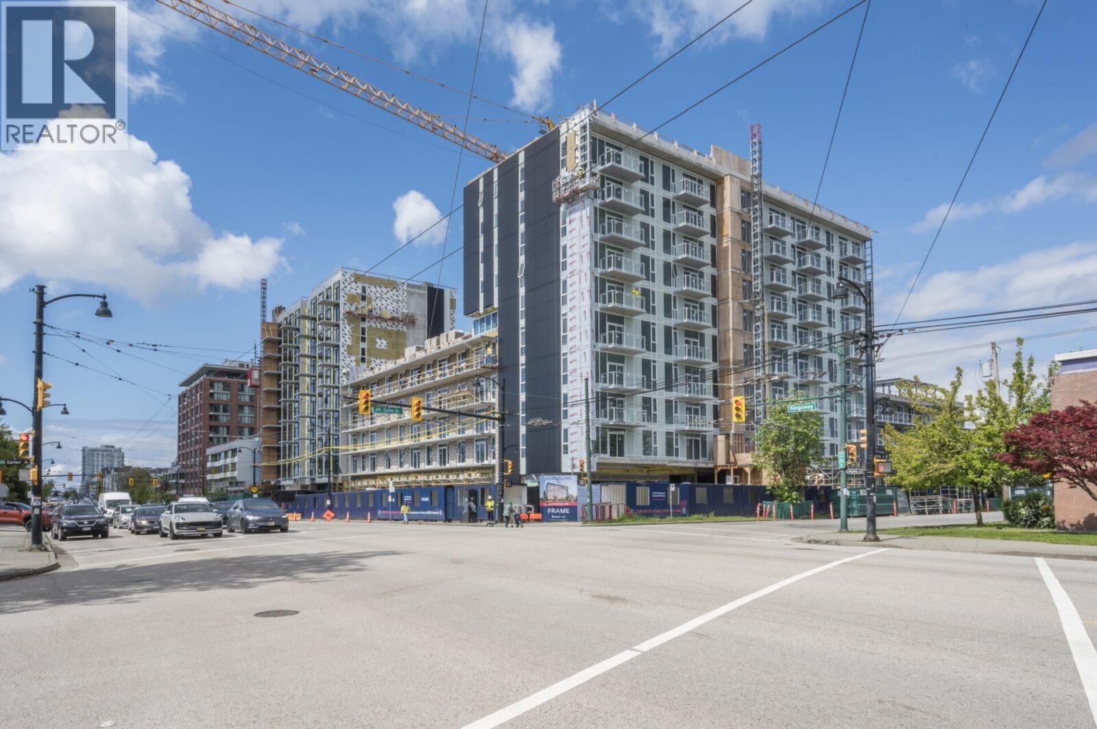 A construction site with a crane and a building under construction.