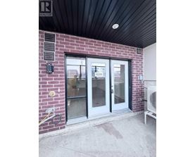 A glass door with a number 102B on it.