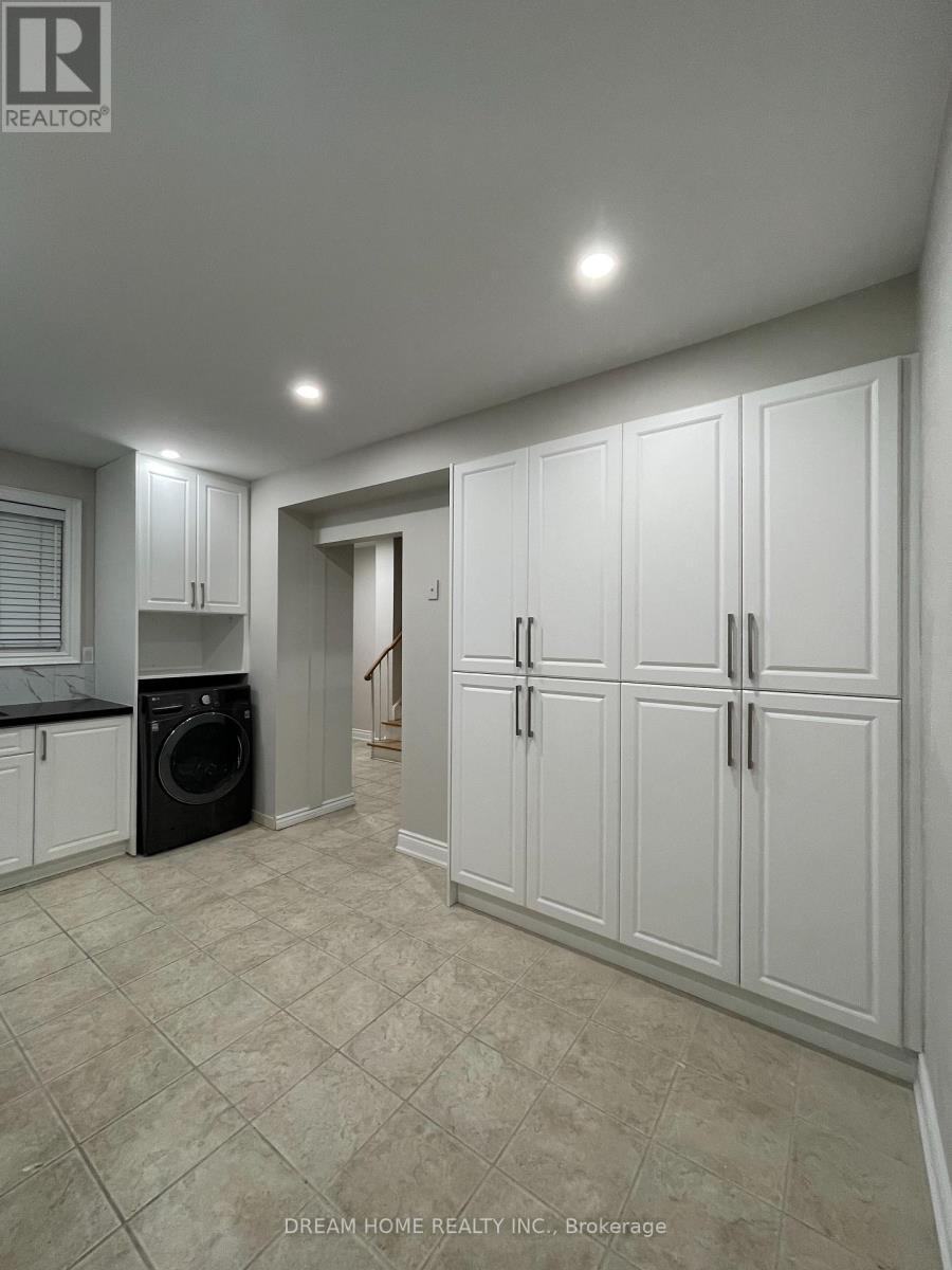 A laundry room with a washer and dryer in it.