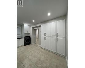 A laundry room with a washer and dryer in it.