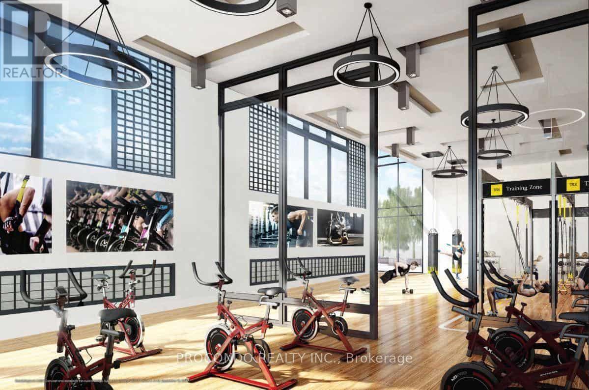 A gym with exercise bikes and a wall of pictures of people exercising.