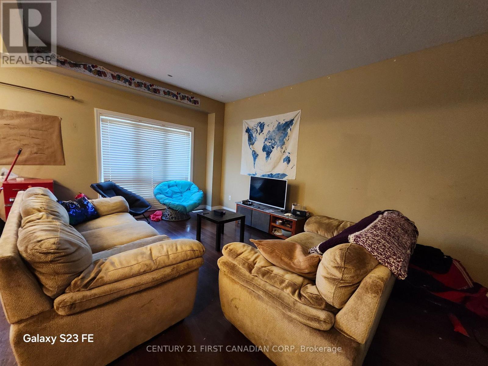 A living room with two couches and a television.