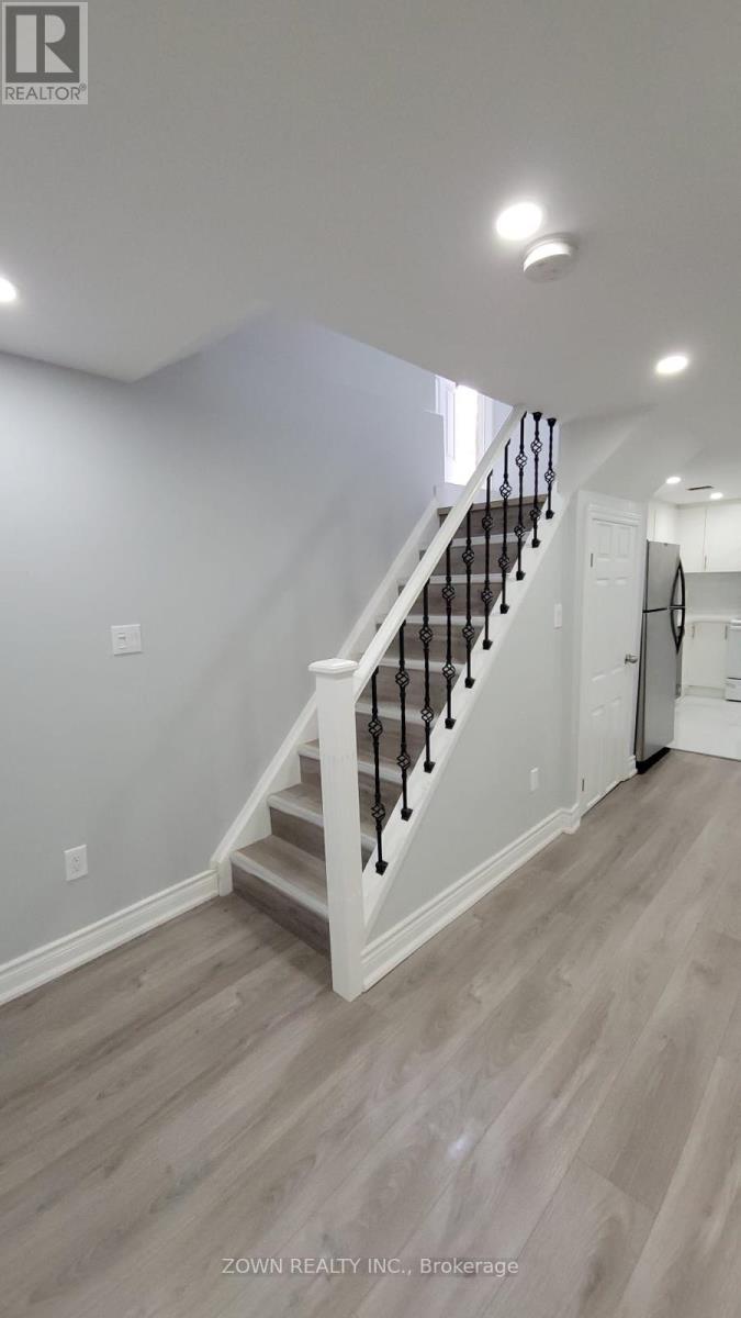 A staircase with a white railing and wooden steps.