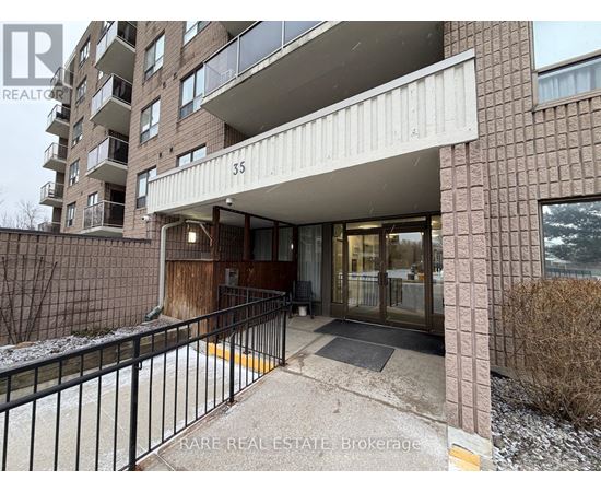 The entrance to a building with a sign that reads "RARE REAL ESTATE Brokerage".