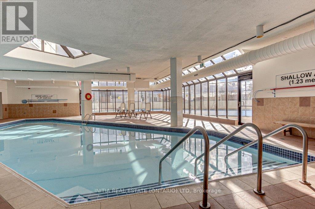 A large indoor swimming pool with a shallow end.