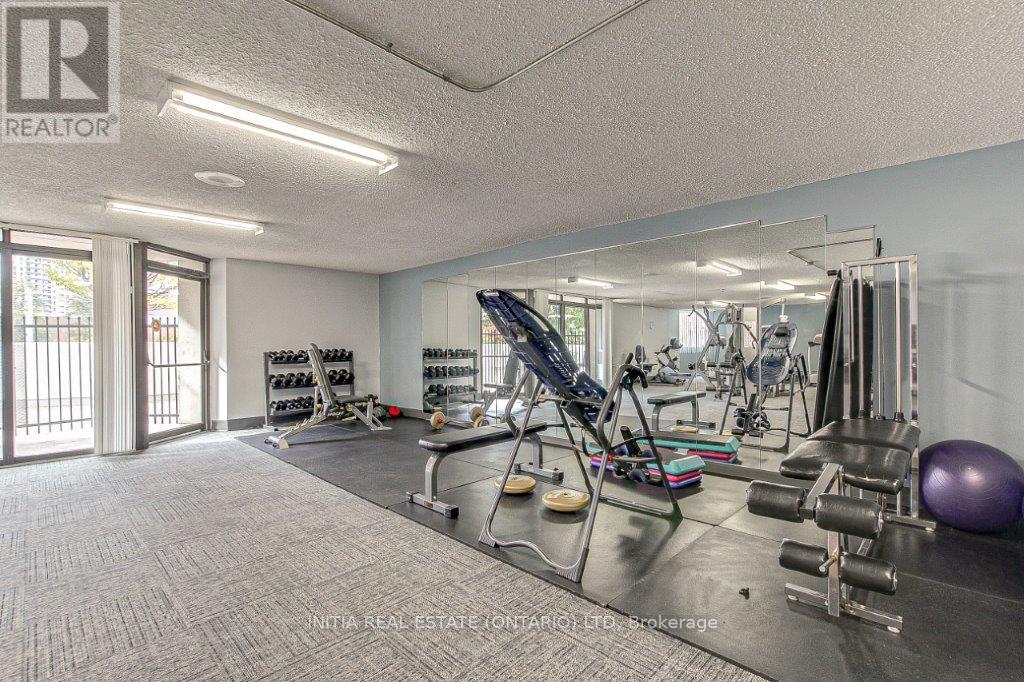 A well-equipped home gym with a variety of exercise equipment.