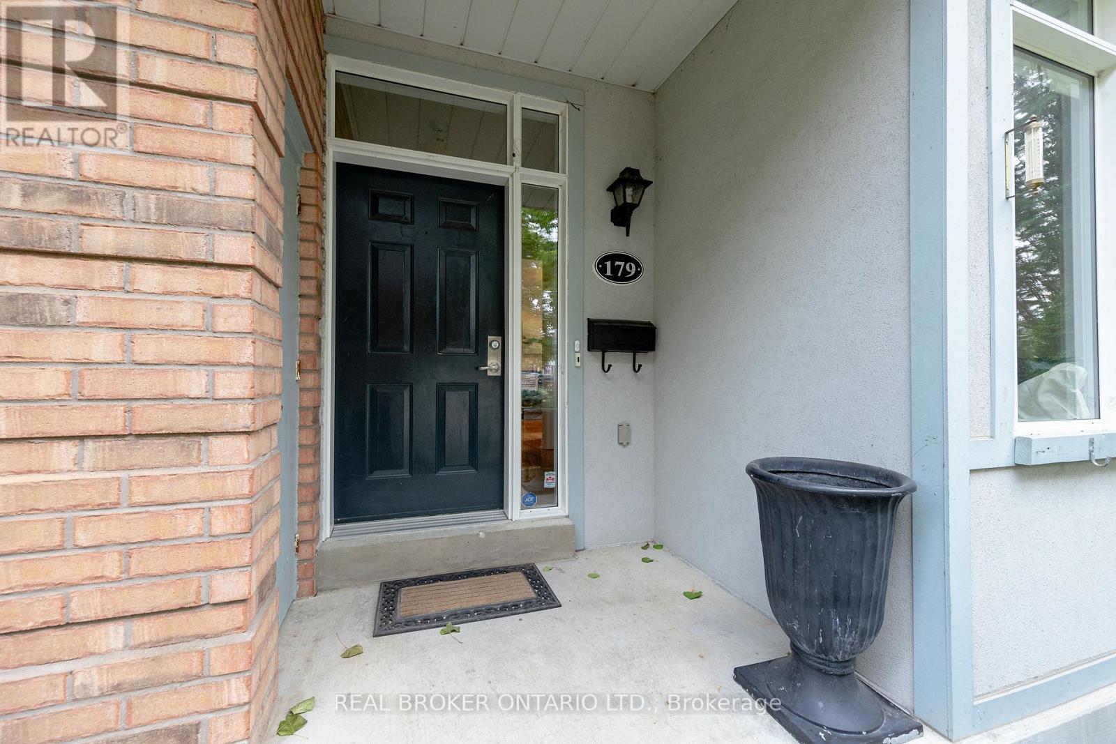 A black door with a glass window is on the left side of the image.