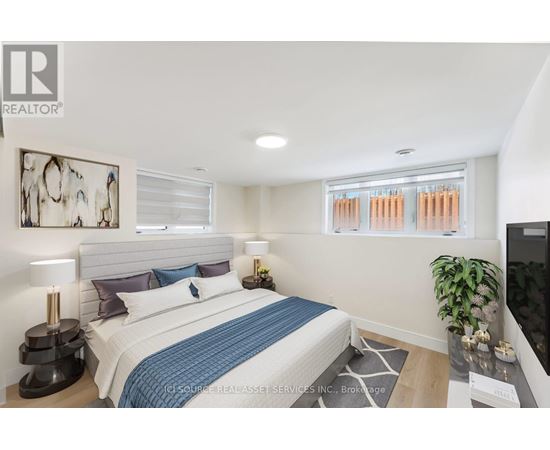 A bedroom with a bed, a lamp, a plant, and a painting on the wall.
