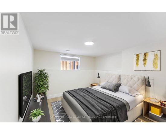 A bedroom with a large bed and a flat screen TV.