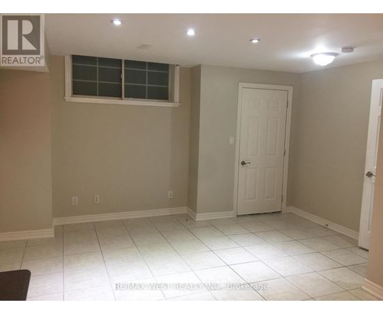 A room with a white door and a window.