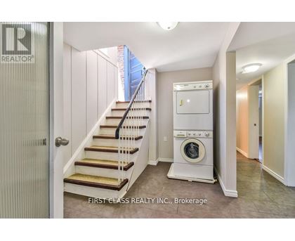 A realtor photo of a laundry room with a washer and dryer.