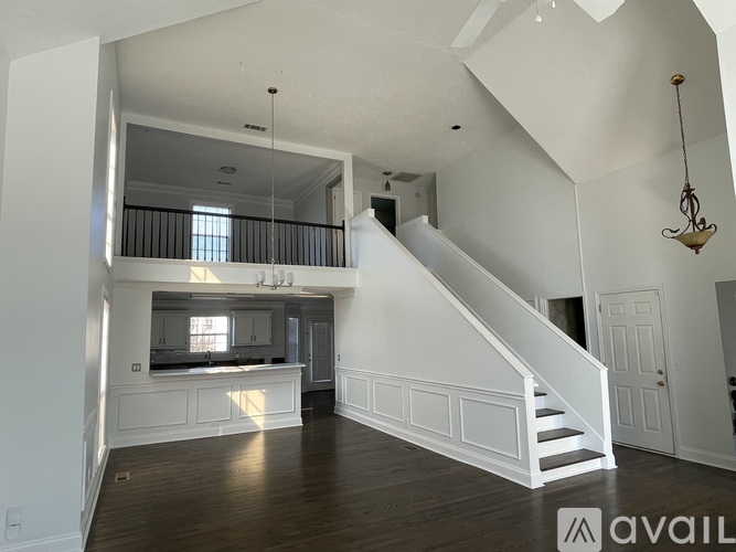 A large open space with a staircase leading to the upper level.