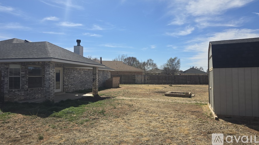 A house with a yard is for sale.