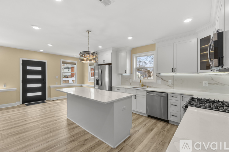 A modern kitchen with a large island in the center.