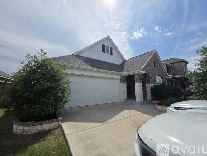 A house with a white garage door is for sale.