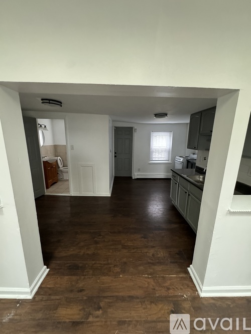 A kitchen area with a counter and cabinets.