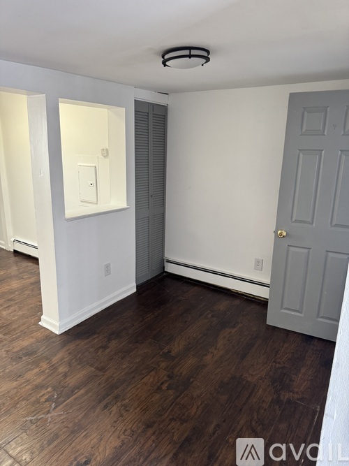 A kitchen with a washer and dryer built in.