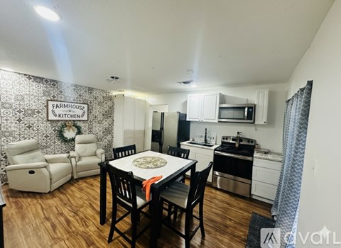 A kitchen with a sign that says Farmhouse Kitchen.