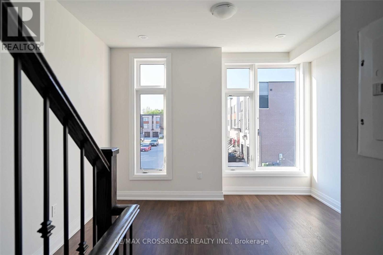 A room with a staircase leading to the upper floor.