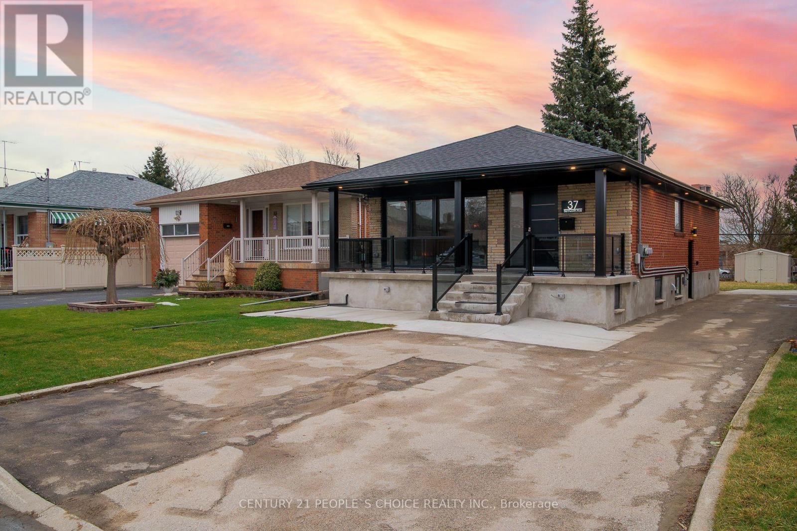 A house with a driveway in front of it.
