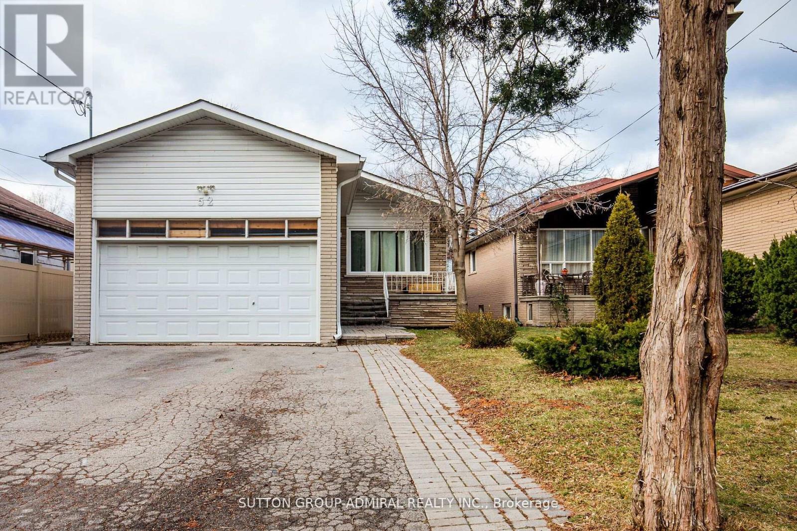 A house with a white garage door is for sale.